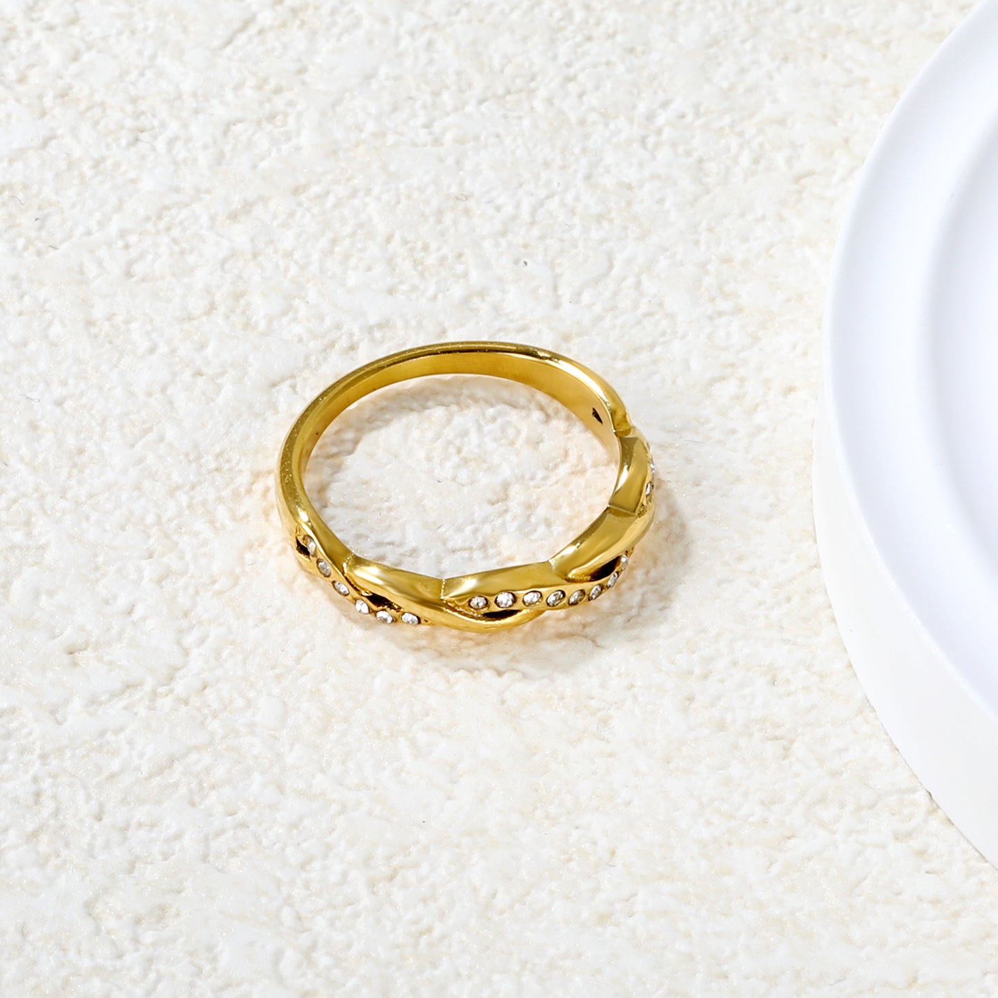 ANILLO TRENZADO ZIRCONIAS