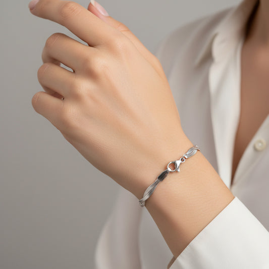 PULSERA PLANCHADA TRENZADA PLATEADA