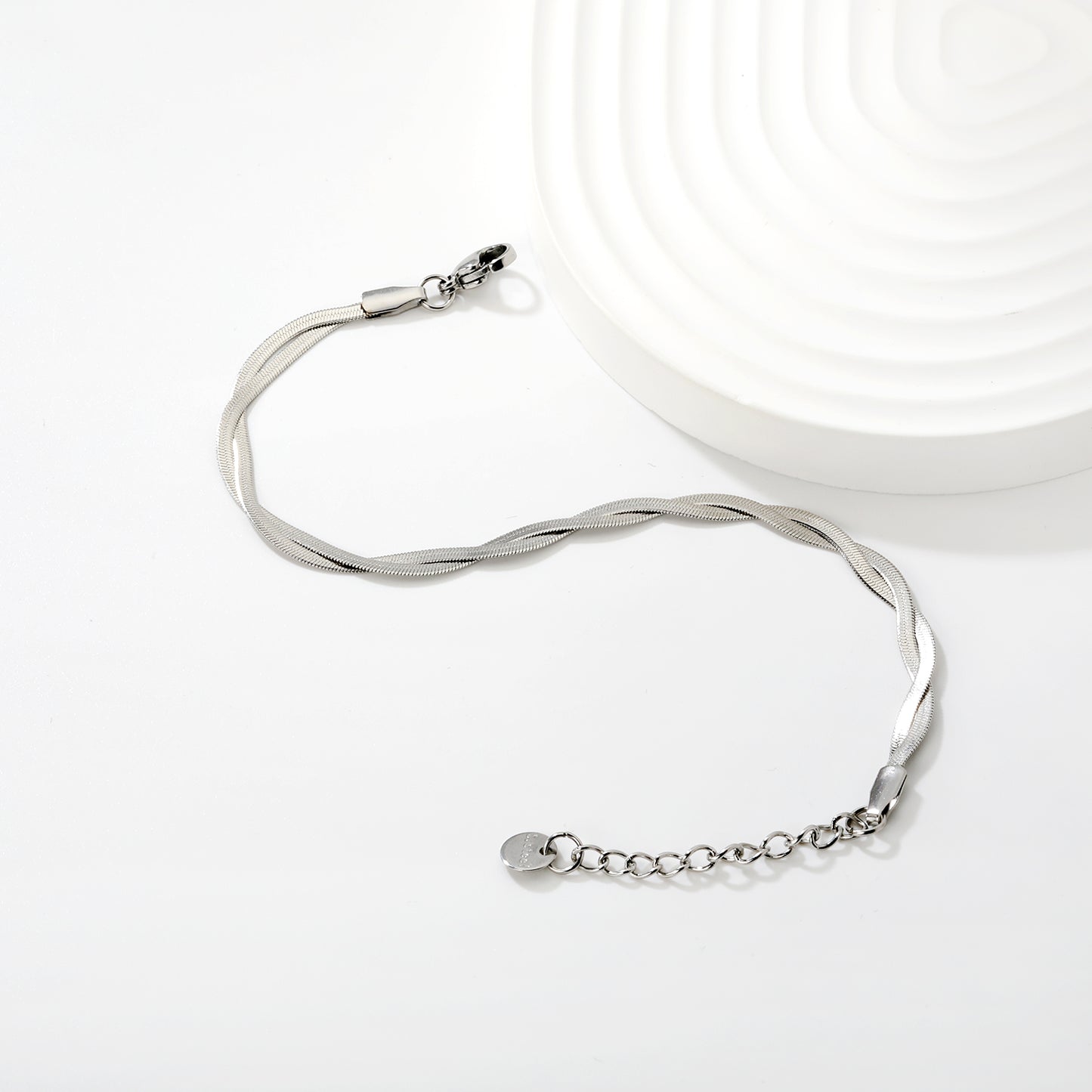 PULSERA PLANCHADA TRENZADA PLATEADA