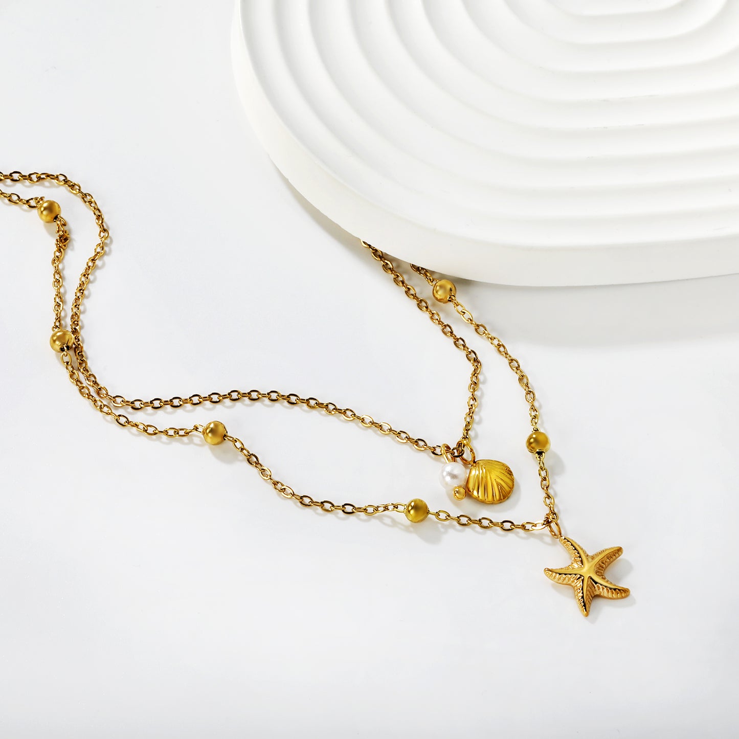 COLLAR DOBLE MINI ESTRELLA PERLA