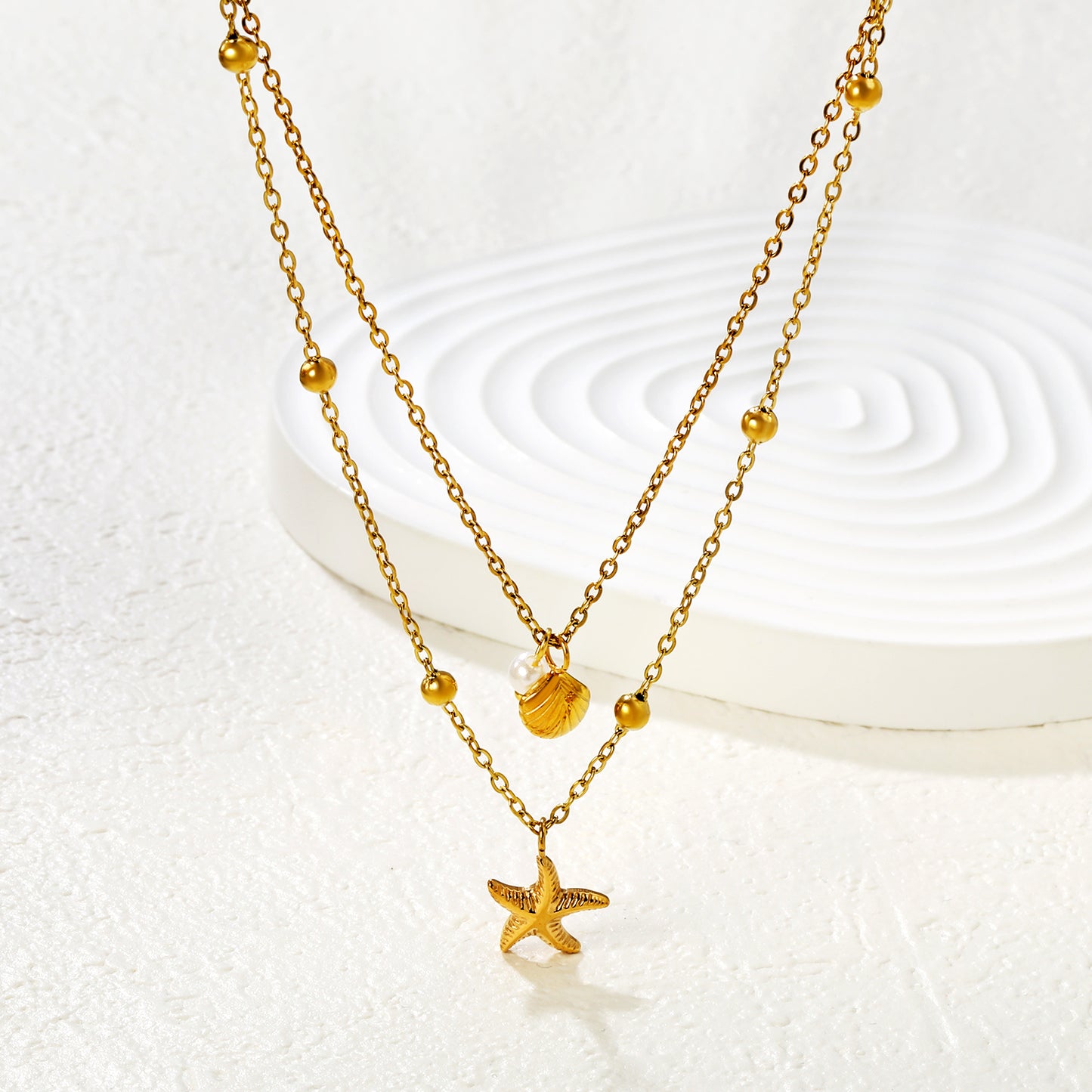 COLLAR DOBLE MINI ESTRELLA PERLA