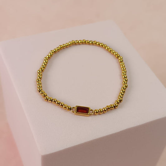 PULSERA BAGUETTE ROJA BOLITAS DORADA