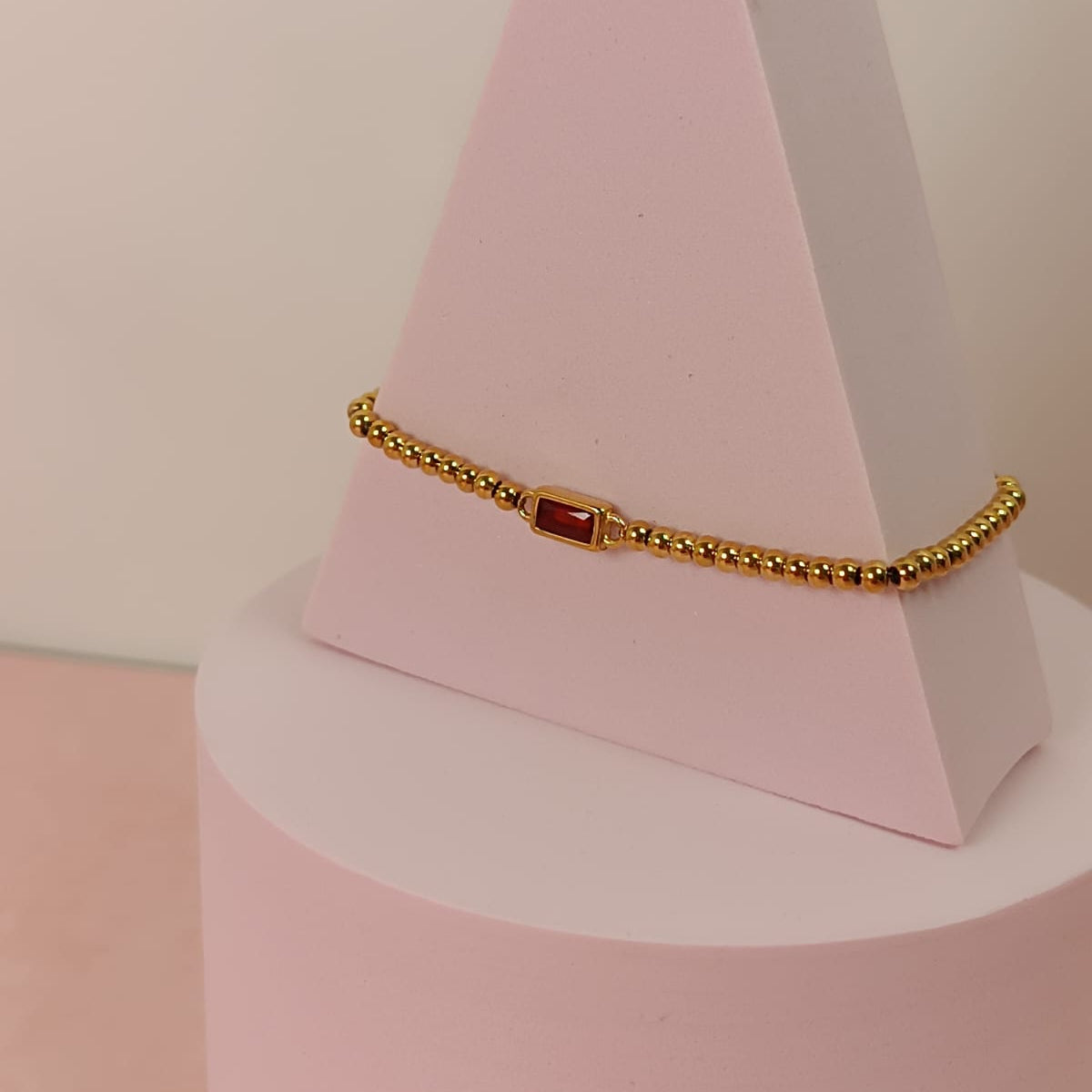 PULSERA BAGUETTE ROJA BOLITAS DORADA