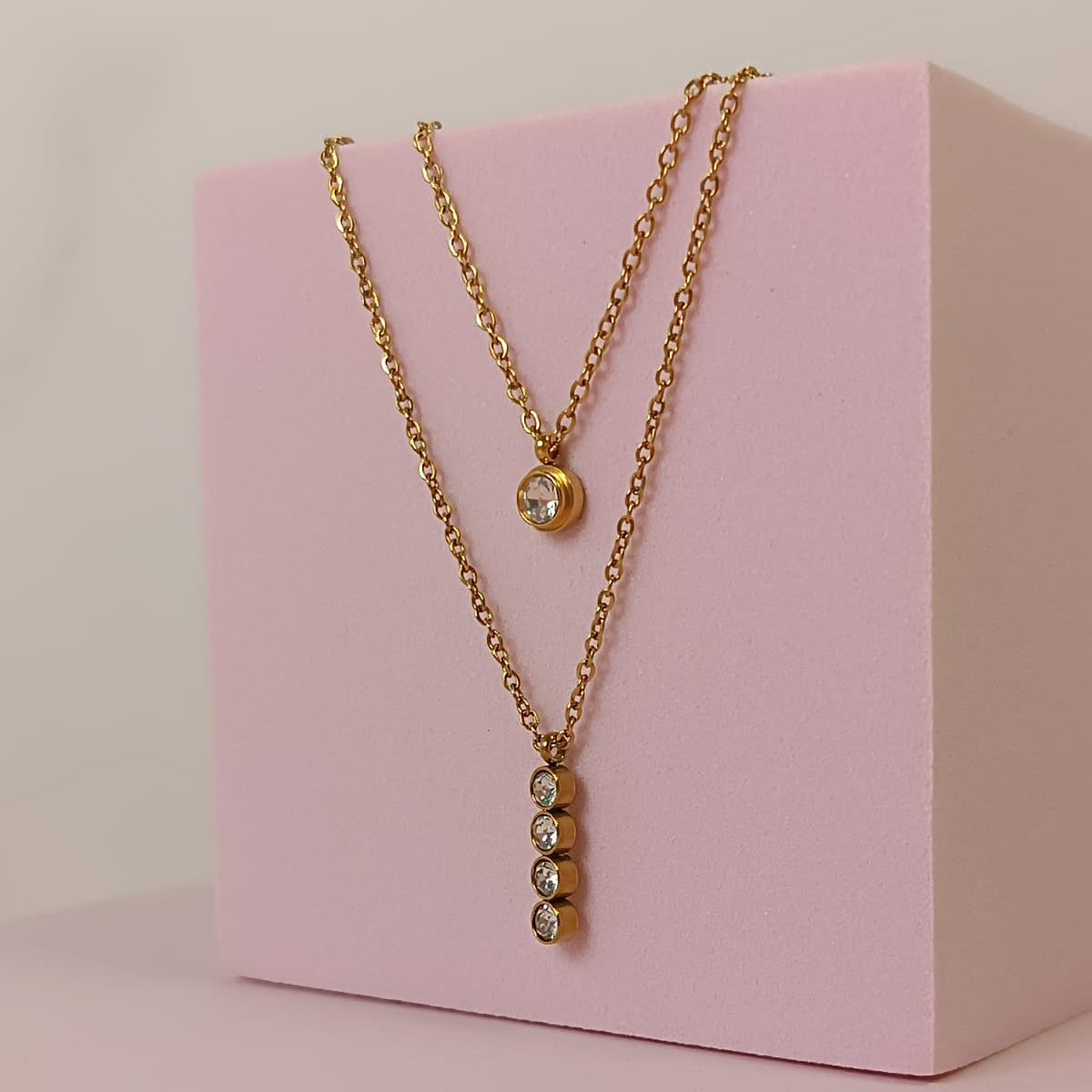 COLLAR DOBLE BARRA 4 ZIRCONIAS DORADO