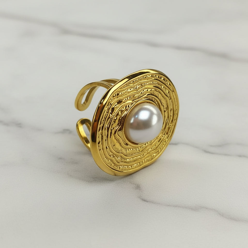 ANILLO OVALO RAYAS PERLA CENTRO