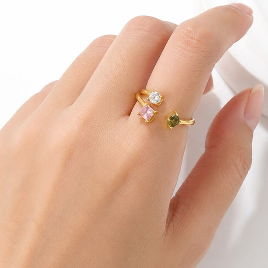 ANILLO 3  ZIRCONIAS GEOMETRICAS VERDE ROSA Y BLANCO